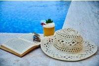 A Beige Straw Hat Book Sunglasses And Drink Beside A Pool Photo By Engin Akyurt From Pexels